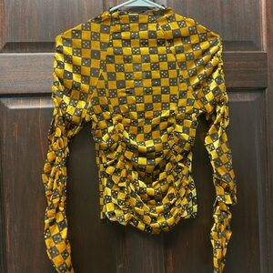 UO Gold and Black Checkered Dice top